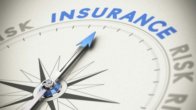 A compass with the needle pointing toward the word "INSURANCE," while the word "RISK" appears multiple times around the edges. The image symbolizes insurance as a way to navigate or manage risk.